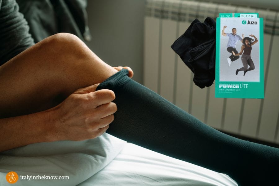 Woman pulling on a compression sock
