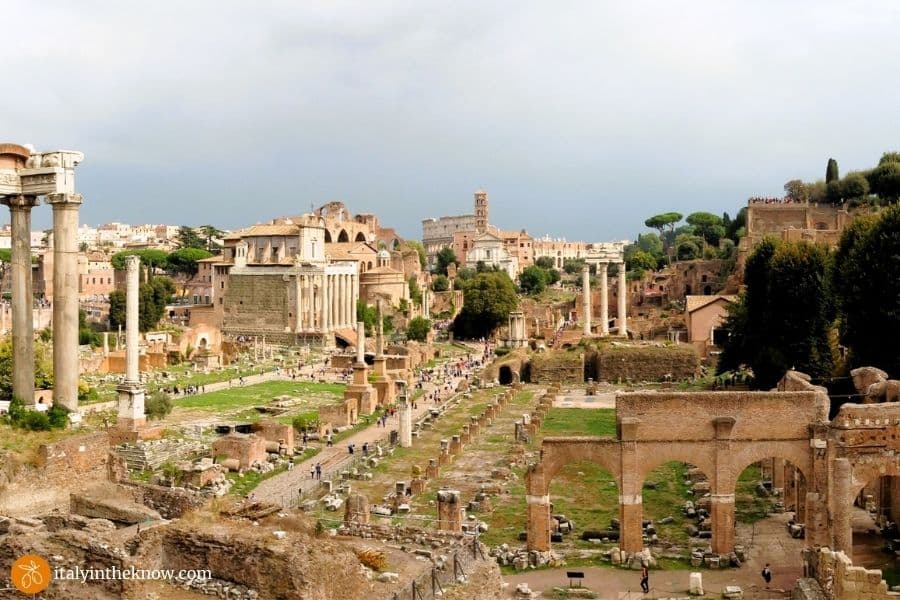 Roman Forum with Palatine Hill to the right and the Colosseum in the distance
