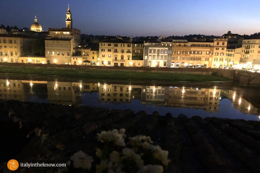 View of the Arno River and Oltrarno at twilight in Florence, Italy