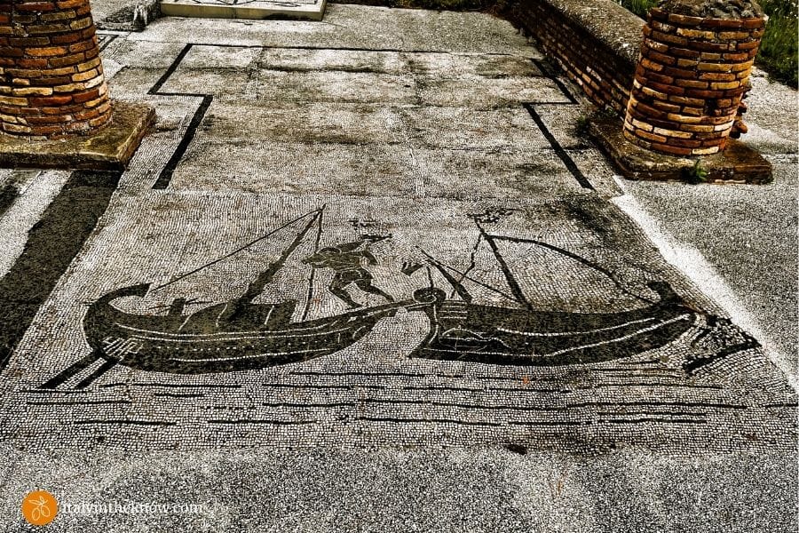 Mosai of a man carrying an amphora from a cargo ship to a river boat