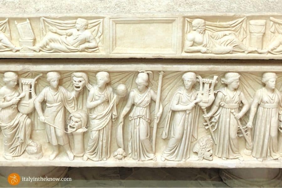 Detail of marble sarcophagus with muses showing various arts