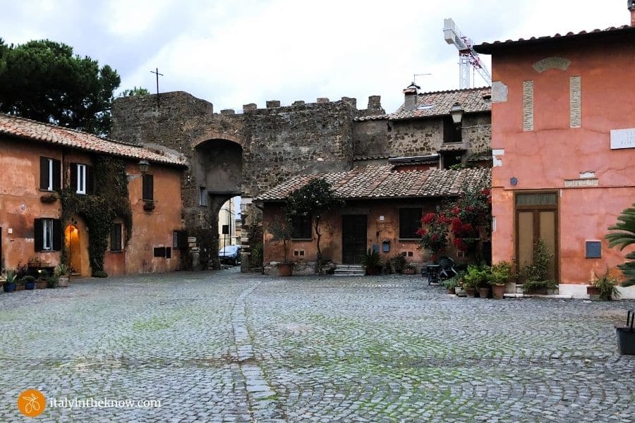 entrance and courtyard of the walled Village of Ostia Antica