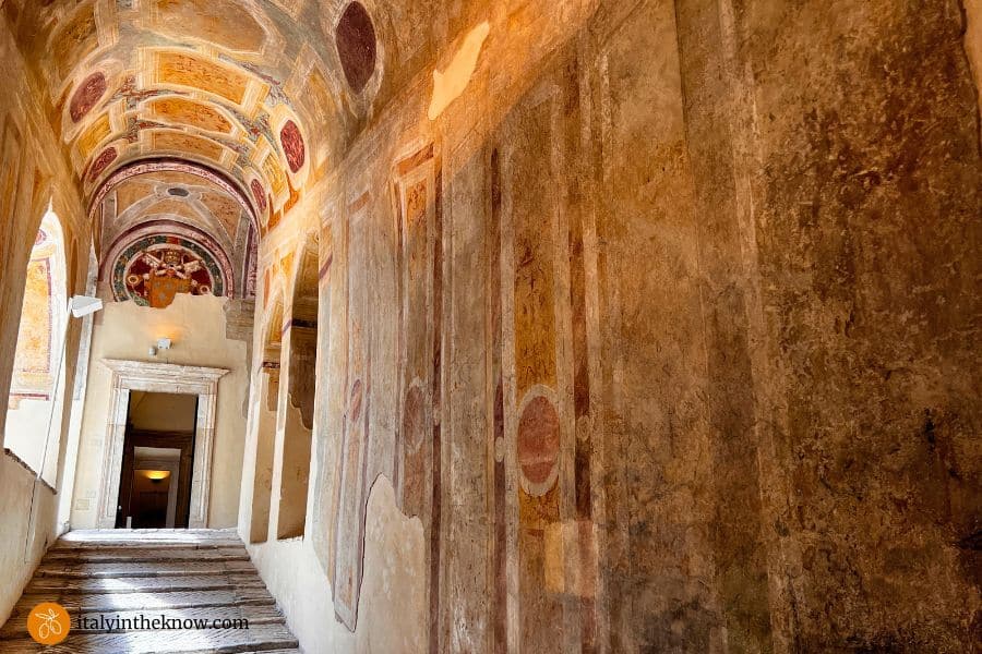 Large staircase with frescoed walls in the castle