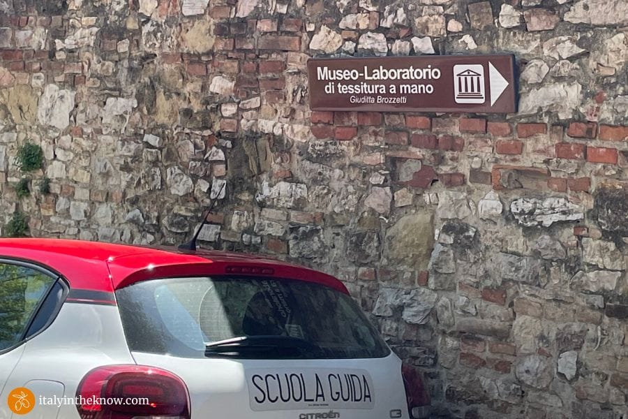 Sign directing to Giuditta Brozzetti Museum Atelier