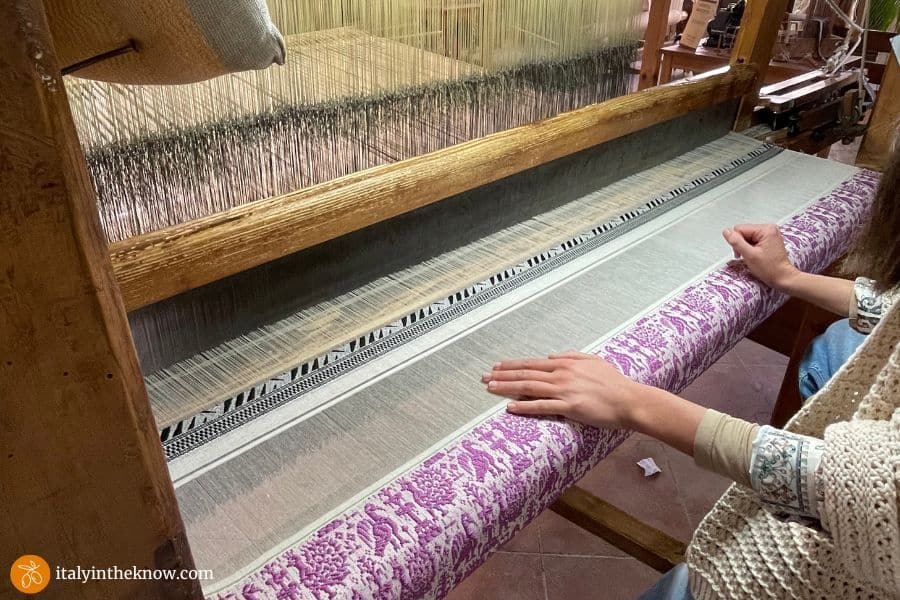Woman weaving on a loom