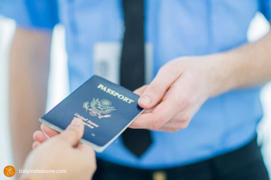 handing a passport to an official