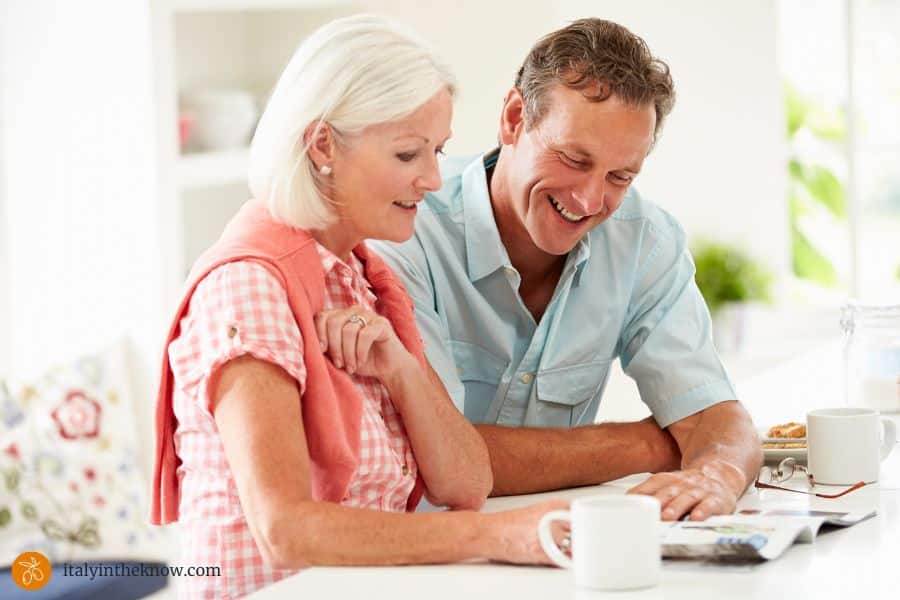 Man and woman planning trip to Italy for Jubilee 2025.