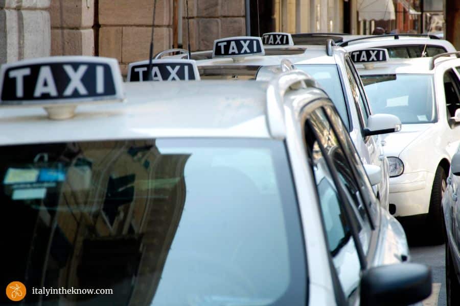 Taxi stand with queue of taxis in Rome.